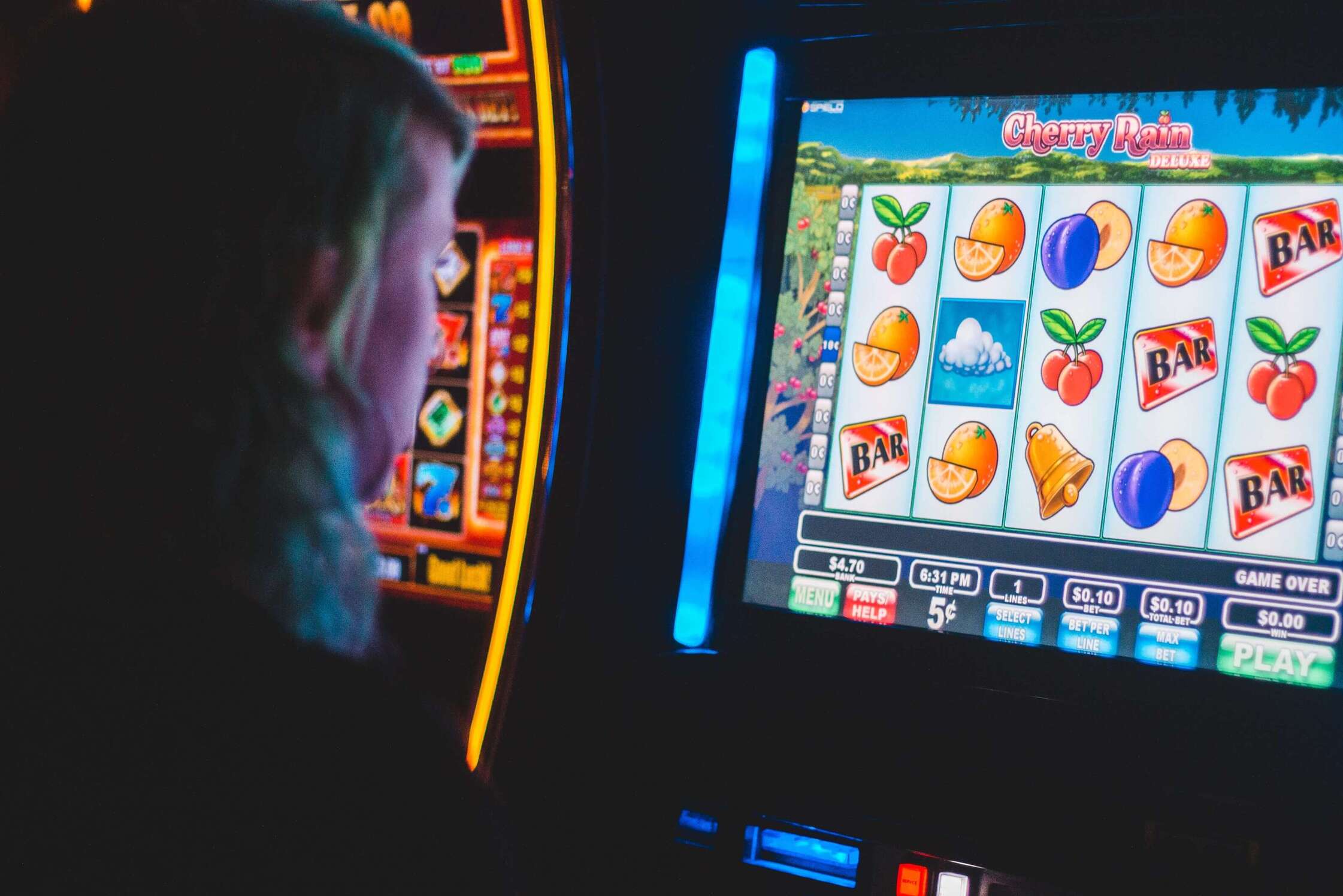 Person playing a slot machine