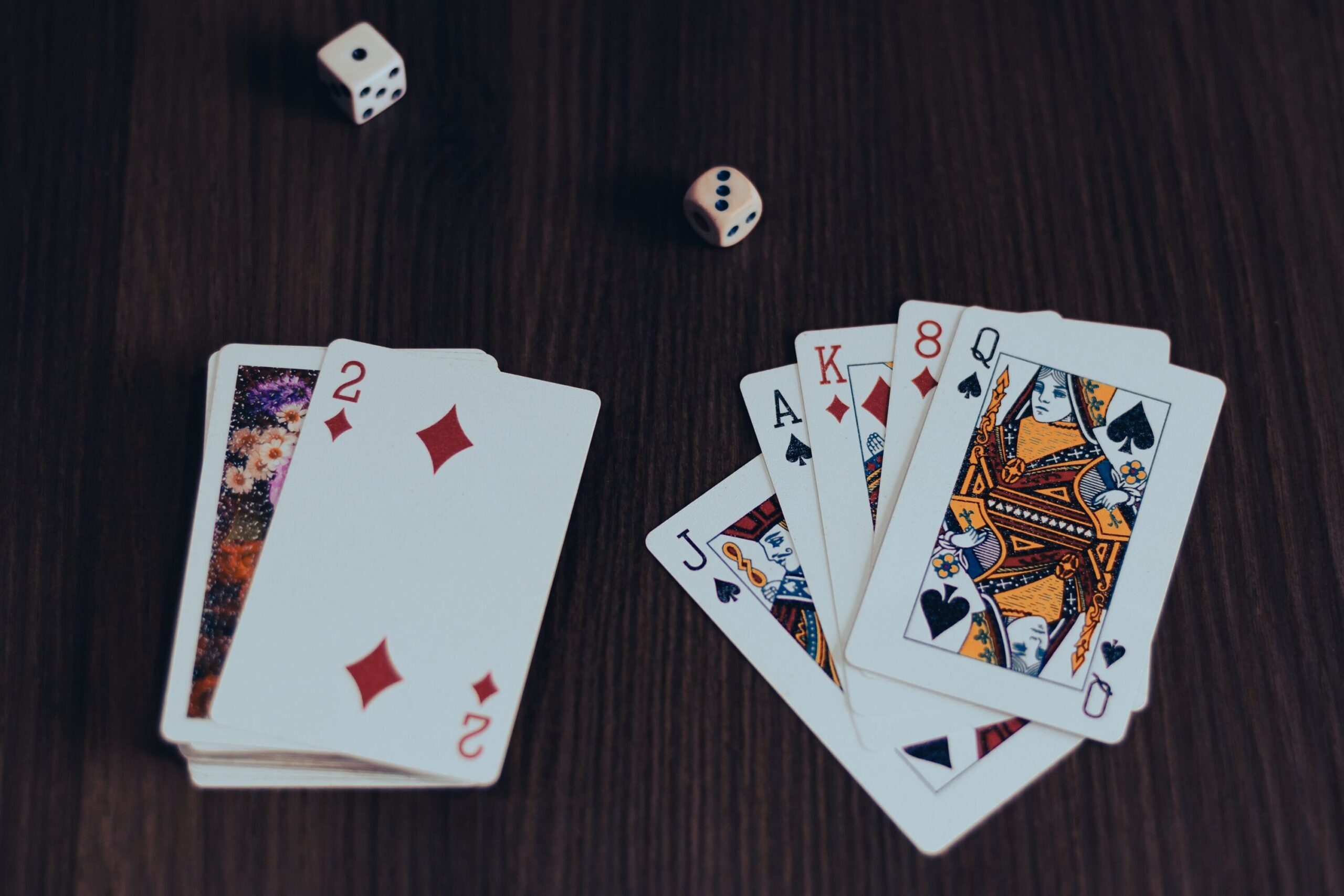 Playing cards on a wooden table.